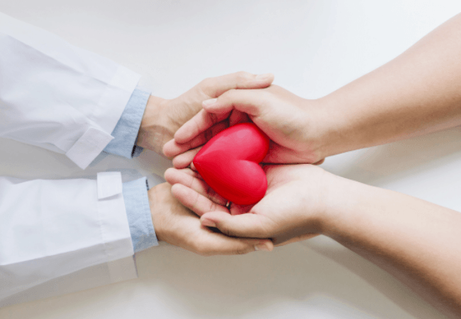 Cardiologist re assuring a patient